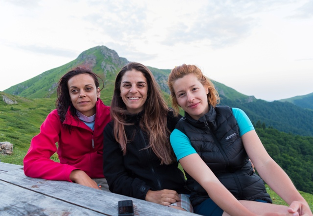 three girls on the way in the mountain